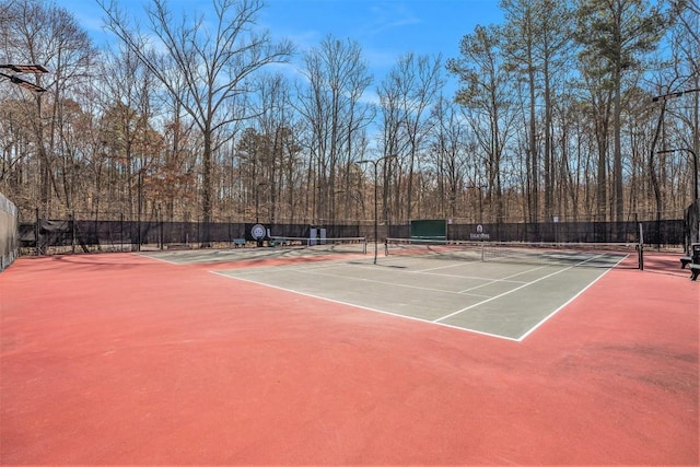 view of sport court featuring community basketball court and fence