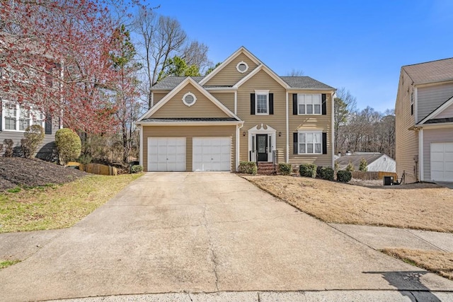 view of front of property featuring a garage and concrete driveway