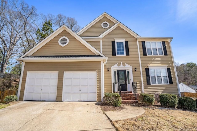 view of front of property featuring an attached garage and driveway