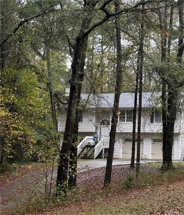 view of side of home with a garage