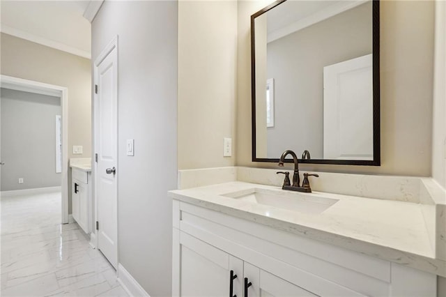 bathroom featuring vanity, baseboards, and marble finish floor