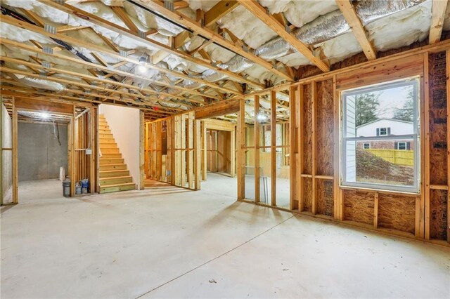 basement featuring stairs