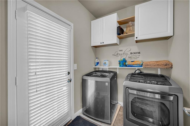 2677 Sardis Chase Ct, Buford, GA 30519 - laundry area featuring cabinet space, washing machine and clothes dryer, and baseboards