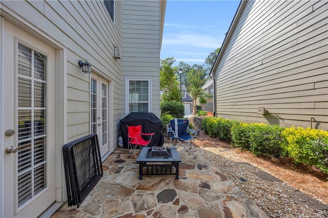2677 Sardis Chase Ct, Buford, GA 30519 - view of patio featuring french doors, a fire pit, and grilling area