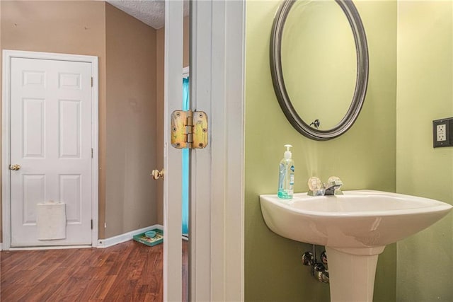 121 Ashgate Way, Carrollton, GA 30117 - bathroom featuring wood finished floors and baseboards