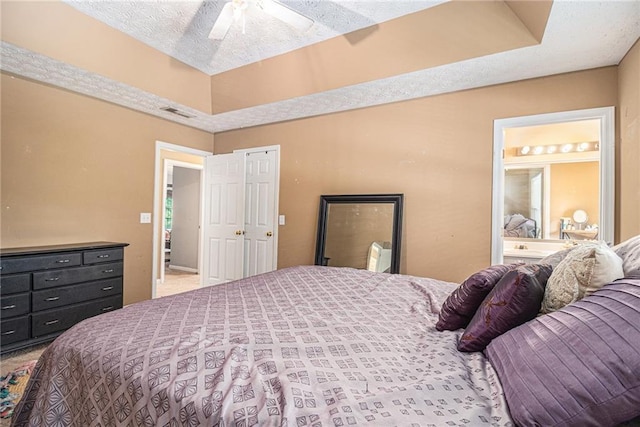 121 Ashgate Way, Carrollton, GA 30117 - carpeted bedroom featuring connected bathroom and ceiling fan
