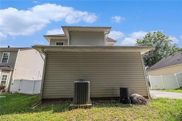 121 Ashgate Way, Carrollton, GA 30117 - back of property featuring central AC and a gate