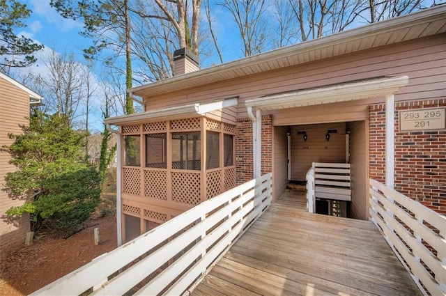 wooden terrace with a sunroom