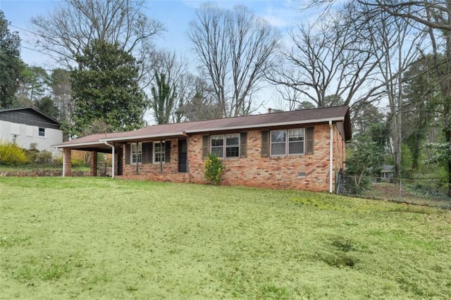 ranch-style home with brick siding, fence, crawl space, a front yard, and a carport