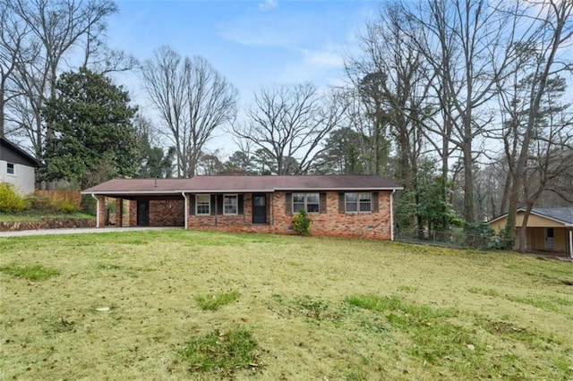 ranch-style home with brick siding, an attached carport, and a front yard