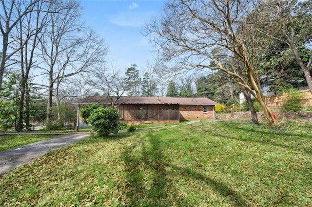 view of yard featuring aphalt driveway