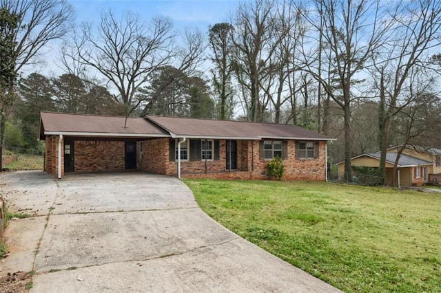 single story home with a front yard, a carport, and driveway