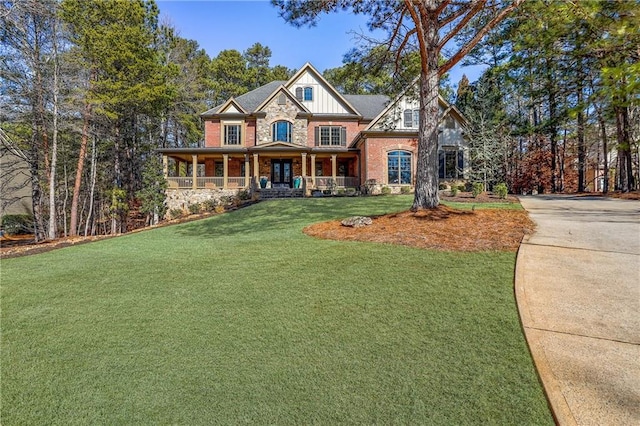 view of front of home with a front lawn and covered porch