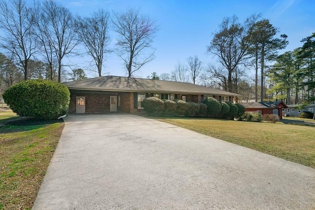 ranch-style house with a carport and a front yard