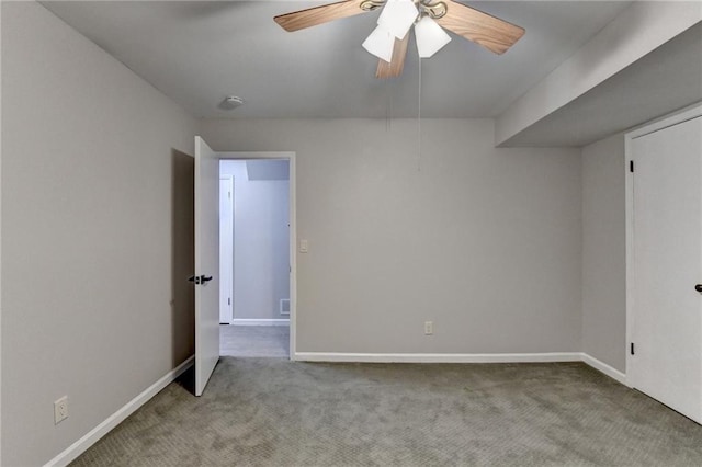 interior space with ceiling fan, carpet flooring, and baseboards