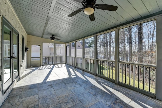 unfurnished sunroom featuring wooden ceiling