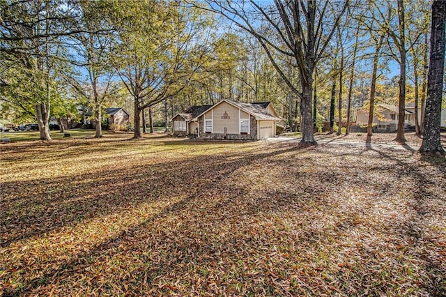 view of yard featuring a garage