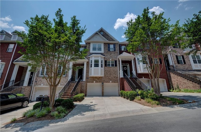 1622 Rivergreen Bnd SE Unit 26, Atlanta, GA 30339 - multi unit property with stairway, a garage, driveway, and brick siding