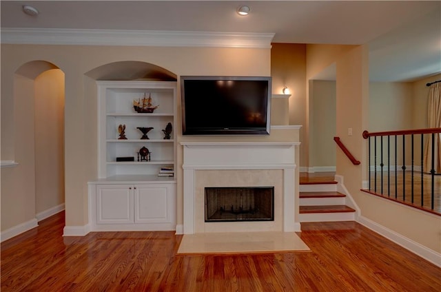 1622 Rivergreen Bnd SE Unit 26, Atlanta, GA 30339 - unfurnished living room featuring wood finished floors, a high end fireplace, crown molding, and stairs