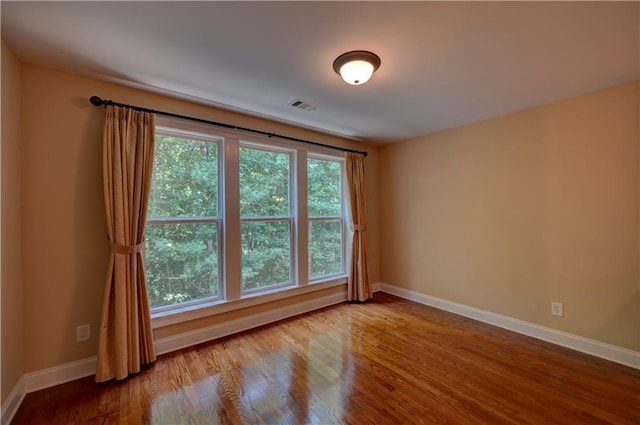 1622 Rivergreen Bnd SE Unit 26, Atlanta, GA 30339 - spare room with baseboards and wood finished floors