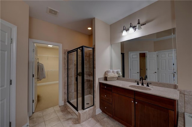 1622 Rivergreen Bnd SE Unit 26, Atlanta, GA 30339 - full bathroom with a stall shower, vanity, tile patterned flooring, and a spacious closet