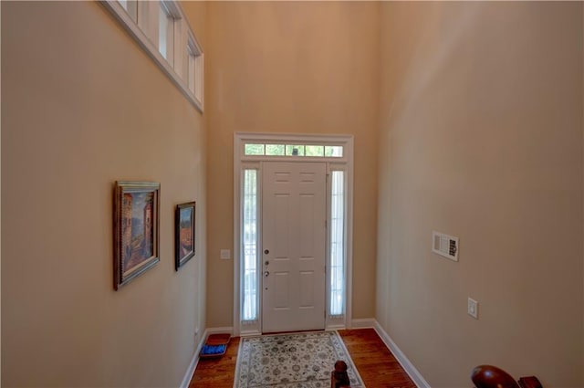 1622 Rivergreen Bnd SE Unit 26, Atlanta, GA 30339 - foyer entrance with dark wood-style floors and a towering ceiling