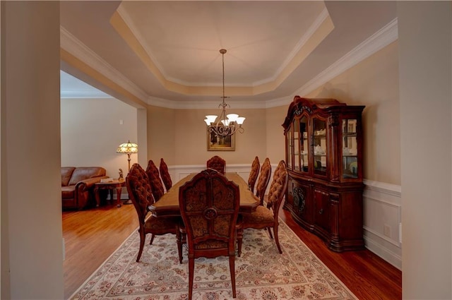 1622 Rivergreen Bnd SE Unit 26, Atlanta, GA 30339 - dining space featuring a raised ceiling, a chandelier, wood finished floors, and crown molding