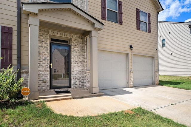 doorway to property featuring a garage