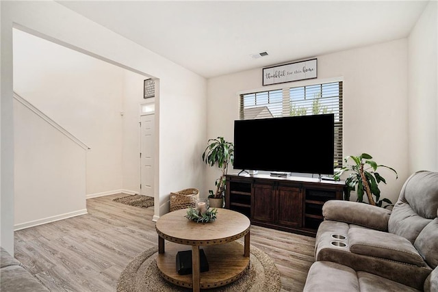 living room with light hardwood / wood-style flooring