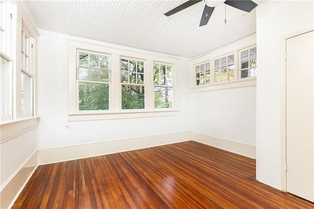 empty room with hardwood / wood-style flooring and ceiling fan