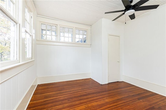 empty room featuring ceiling fan, wooden ceiling, and dark hardwood / wood-style floors