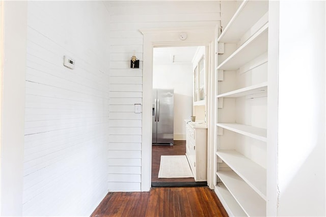 hallway with dark hardwood / wood-style floors