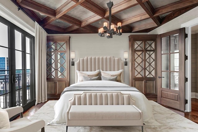 bedroom featuring beamed ceiling, access to outside, coffered ceiling, and a chandelier