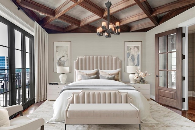 bedroom featuring coffered ceiling, hardwood / wood-style floors, beamed ceiling, a notable chandelier, and access to exterior