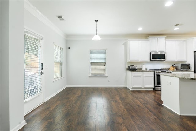 60 Copeland Trce, Dallas, GA 30157 - kitchen with appliances with stainless steel finishes, ornamental molding, light stone countertops, decorative light fixtures, and white cabinets