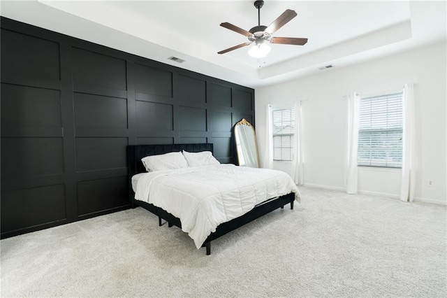 60 Copeland Trce, Dallas, GA 30157 - bedroom featuring a raised ceiling, light colored carpet, ceiling fan, and baseboards