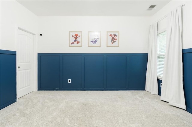 60 Copeland Trce, Dallas, GA 30157 - unfurnished bedroom with a decorative wall, carpet flooring, and a wainscoted wall