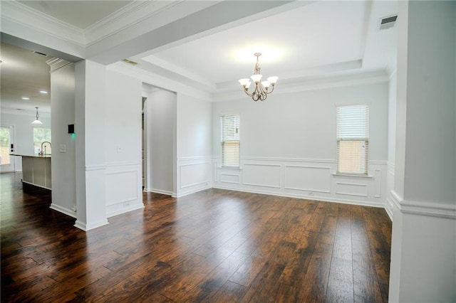 60 Copeland Trce, Dallas, GA 30157 - spare room featuring dark wood-style floors, a chandelier, a raised ceiling, wainscoting, and a sink