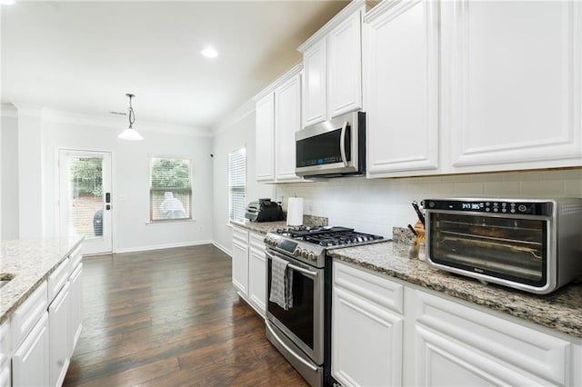 60 Copeland Trce, Dallas, GA 30157 - kitchen with appliances with stainless steel finishes, ornamental molding, tasteful backsplash, white cabinets, and dark wood-type flooring