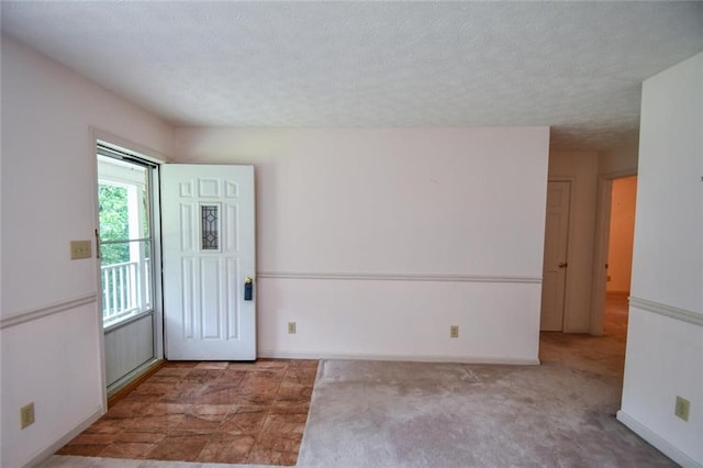 3223 Heritage Way, Buford, GA 30519 - unfurnished room featuring baseboards, carpet, and a textured ceiling
