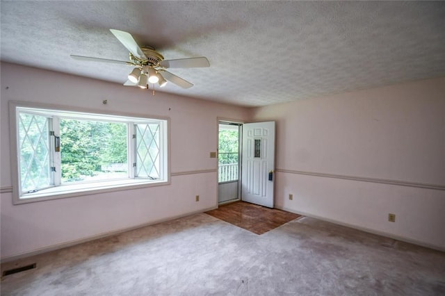 3223 Heritage Way, Buford, GA 30519 - unfurnished room featuring carpet, a textured ceiling, baseboards, and ceiling fan