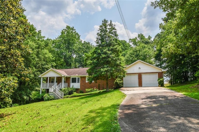 3223 Heritage Way, Buford, GA 30519 - ranch-style home with brick siding, a porch, a front lawn, stairway, and a detached garage