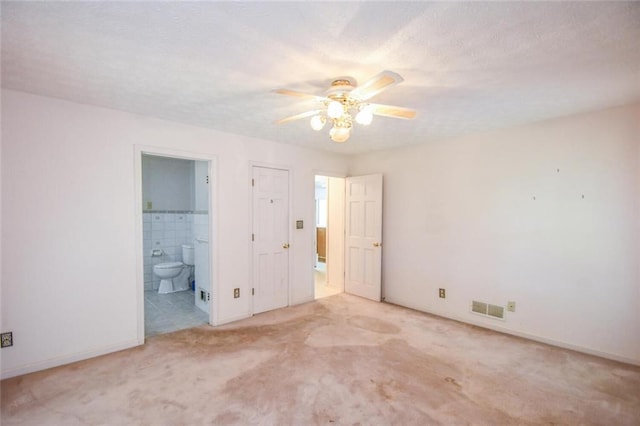 3223 Heritage Way, Buford, GA 30519 - unfurnished bedroom with carpet, ensuite bathroom, baseboards, and ceiling fan