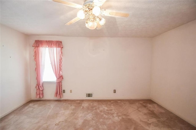 3223 Heritage Way, Buford, GA 30519 - unfurnished room featuring light carpet, a ceiling fan, baseboards, and a textured ceiling