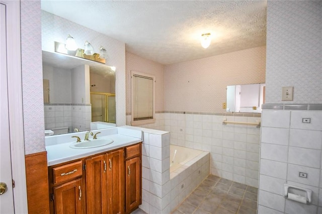 3223 Heritage Way, Buford, GA 30519 - bathroom featuring wallpapered walls, vanity, a bath, a stall shower, and tile patterned flooring