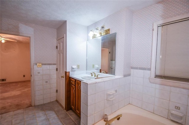 3223 Heritage Way, Buford, GA 30519 - bathroom with wallpapered walls, a garden tub, tile patterned floors, vanity, and ceiling fan