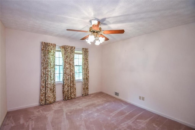 3223 Heritage Way, Buford, GA 30519 - spare room with a ceiling fan, baseboards, carpet, and a textured ceiling