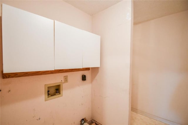 3223 Heritage Way, Buford, GA 30519 - laundry area with cabinet space, hookup for a washing machine, light flooring, and a textured ceiling