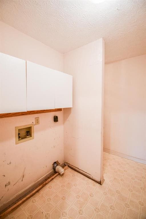 3223 Heritage Way, Buford, GA 30519 - washroom with cabinet space, hookup for a washing machine, light flooring, electric dryer hookup, and baseboards