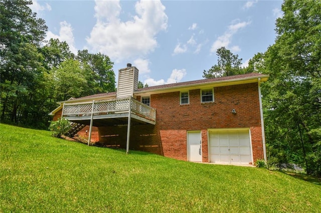 3223 Heritage Way, Buford, GA 30519 - back of house featuring a chimney, a wooden deck, brick siding, a garage, and a yard